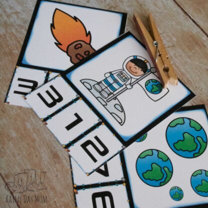 free printable space themed count and clip cards with cartoon images for preschoolers to count and find the matching numbers
